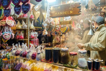 Photo for Bonn, Germany - December 16, 2023 : View of a stand selling almonds and other candies  at the Christmas Market in Bonn Germany - Royalty Free Image