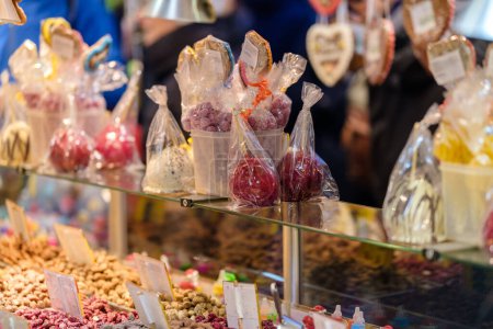 Photo for Bonn, Germany - December 16, 2023 : View of red candy apples and other candies at the Christmas Market in Bonn Germany - Royalty Free Image