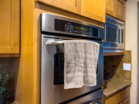 Photo for Angled view of double ovens inside a high end home kitchen - Royalty Free Image