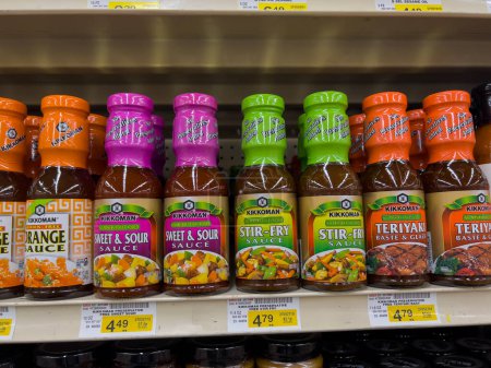 Photo for Woodinville, WA USA - circa December 2022: Close up view of Kikkoman cooking sauces for sale inside a Haggen grocery store. - Royalty Free Image