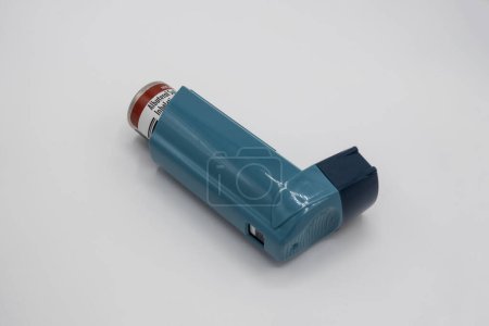 Photo for Seattle, WA USA - circa December 2022: Selective focus on an Albuterol inhaler on a white background. - Royalty Free Image