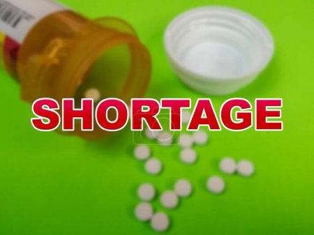 Blurred background of prescription medicine with the word Shortage in the foreground