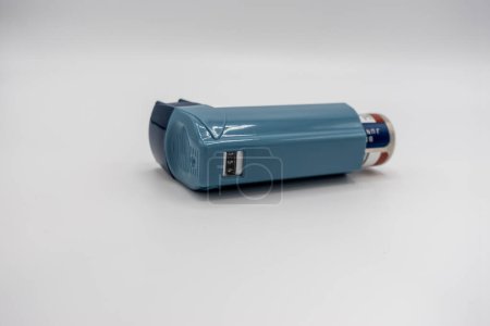 Photo for Selective focus on a blue inhaler on a white background - Royalty Free Image