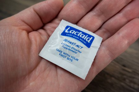 Photo for Seattle, WA USA - circa November 2022: Selective focus on Lactaid medicine in the palm of someone's hand. - Royalty Free Image