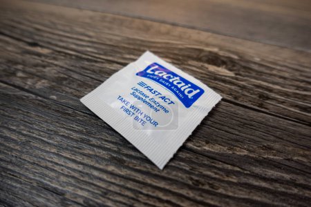Photo for Seattle, WA USA - circa November 2022: Selective focus on Lactaid medicine on a wooden background. - Royalty Free Image