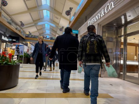 Photo for Bellevue, WA USA - circa December 2022: Wide view of people shopping inside the Bellevue Mall. - Royalty Free Image
