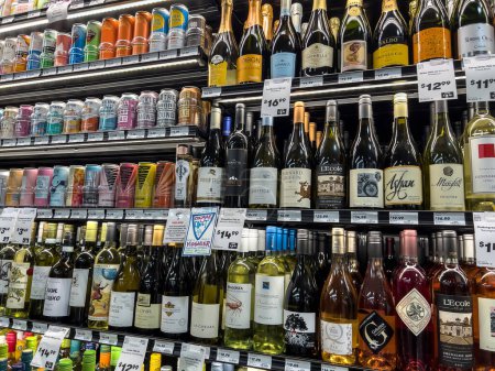 Photo for Mill Creek, WA USA - circa December 2022: Close up view of refrigerated wine products for sale inside a Town and Country grocery store. - Royalty Free Image