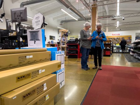 Foto de Kenmore, WA USA - circa December 2022: Wide view of elderly people shopping inside Kenmore Camera store. - Imagen libre de derechos