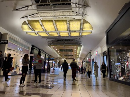 Photo for Lynnwood, WA USA - circa December 2022: Wide view of people shopping inside the Alderwood Mall around Christmas time. - Royalty Free Image