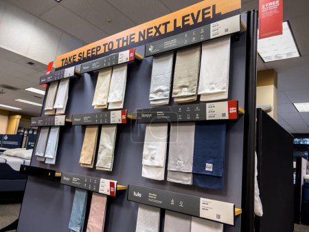 Photo for Woodinville, WA USA - circa November 2022: Wide view of samples of bed sheets available for purchase inside a Mattress Firm store. - Royalty Free Image