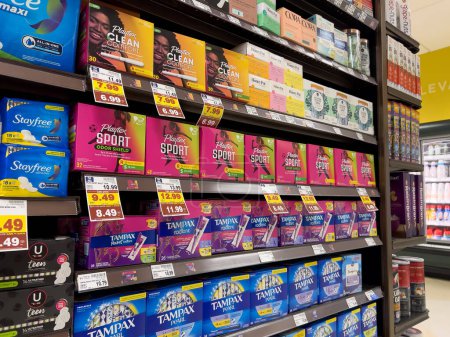 Foto de Lynnwood, WA USA - circa February 2023: Low angle view of feminine hygiene products for sale inside a grocery store. - Imagen libre de derechos