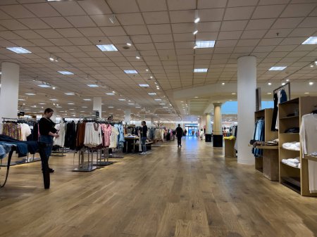 Photo for Lynnwood, WA USA - circa March 2023: Wide view of people shopping inside a Nordstrom clothing store in the Alderwood Mall. - Royalty Free Image