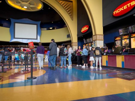 Photo for Lynnwood, WA USA - circa July 2023: Wide view of people in line inside an AMC movie theater. - Royalty Free Image