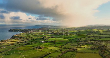 Photo for Light rain mizzle clouds over Ballygally on the Co Antrim Northern Ireland - Royalty Free Image