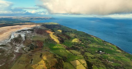 Photo for Aerial view of clouds over Ballygally on the Co Antrim coastline Northern Ireland - Royalty Free Image