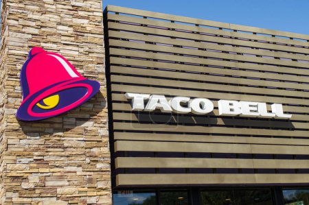 Photo for Exterior store front logo of Taco Bell American fast food chain restaurant, OCALA, FLORIDA USA, OCTOBER 14, 2023 Mexican inspired food of tacos, burritos, quesadillas and nachos based in California - Royalty Free Image