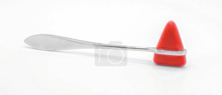 Photo for Red rubber and metal knee reflex hammer is a diagnostic tool used by physicians to test deep tendon reflexes of the neurological peripheral and central nervous system. isolated on white background - Royalty Free Image