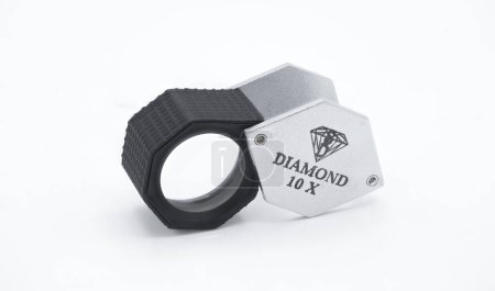 Photo for Large Hexagon Diamond Loupe eye lens pocket magnifier, Black, 10X used by jewelers, watch makers, gemstone inspecting for grading and clarity of stones. isolated on white background version 1 - Royalty Free Image