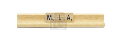 concept of popular newborn baby girl first name of MIA made with square wooden tile English alphabet letters with natural color and grain on a wood rack holder isolated on white background