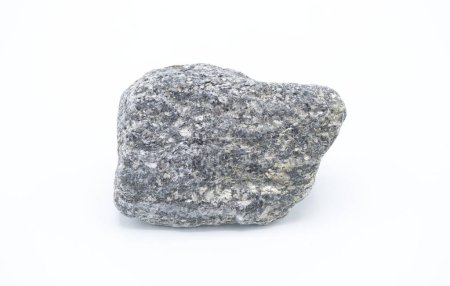 Diorite is an intrusive igneous rock composed principally of the silicate minerals plagioclase feldspar (typically andesine), biotite, hornblende, and sometimes pyroxene, isolated on white background