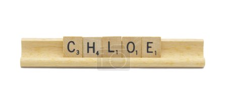 Miami, FL 4-18-24 popular newborn baby girl first name of CHLOE made with square wooden tile English alphabet letters with natural color and grain on a wood rack holder isolated on white background