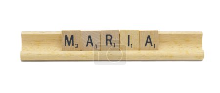 Photo for Miami, FL 4-18-24 popular baby girl first name of MARIA made with square wooden tile English alphabet letters with natural color and grain on a wood rack holder isolated on white background - Royalty Free Image