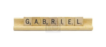 Miami, FL 4-18-24 popular baby boy first name of GABRIEL made with square wooden tile English alphabet letters with natural color and grain on a wood rack holder isolated on white background