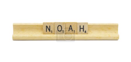 Miami, FL 4-18-24 popular baby boy first name of NOAH made with square wooden tile English alphabet letters with natural color and grain on a wood rack holder isolated on white background