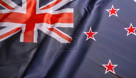orgullo de la bandera del mundo o juegos olímpicos o el concepto olímpico de una bandera del país Nueva Zelanda con gato de la unión y cuatro estrellas rojas en base azul, aislado con colores y diseño, textura