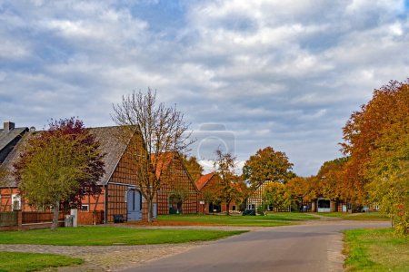 Photo for Luechow, Lower Saxony, Germany - 31 October 2021: View of the historic hall houses in the listed Rundling village of Satemin - Royalty Free Image