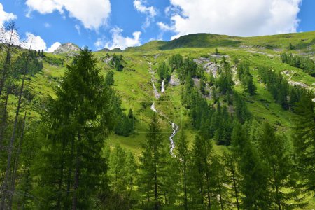 Photo for Mountain slopes with a waterfall in Ankogelgruppe, High Tauern, Austria - Royalty Free Image