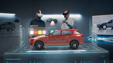 Photo for Two development engineers choose a color for a future eco-friendly sustainable electric car prototype. Using virtual reality headset and hologram. Cutting edge technology. Car design developers. - Royalty Free Image