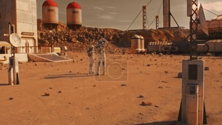 Téléchargez les photos : Deux astronautes, des scientifiques en combinaison spatiale marchent sur Mars. Station de recherche, colonie ou base scientifique sur la planète rouge. Explorer la mission spatiale. Concept futuriste de colonisation et d'exploration. - en image libre de droit