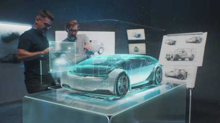 Photo for Two professional automotive engineers choose body of new eco-friendly electric car using futuristic augmented reality hologram. 3D computer graphics of vehicle high-tech developing. VFX animation. - Royalty Free Image