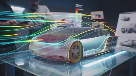 Foto de Dos ingenieros automotrices comprueban la aerodinámica del coche eléctrico nuevo usando el prototipo holográfico del automóvil de la realidad aumentada futurista. 3D gráficos por computadora de vehículos de alta tecnología en desarrollo y pruebas. - Imagen libre de derechos