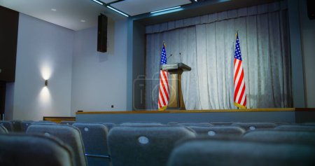 Photo for Tribune for the presidential candidate of the United States political speech in the White House. Press campaign room with seats and American flags. Conference debate stand with microphones on stage. - Royalty Free Image