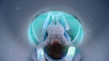 Woman undergoes MRI or CT scan, lies on bed inside the machine. Visual effects of scanning female patient brain and body. High-tech equipment in modern medical lab with augmented reality technologies.