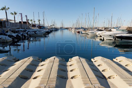 Photo for Floating pontoons for a jet ski in a yacht marina. - Royalty Free Image
