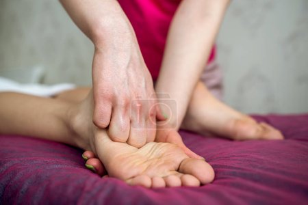 Photo for Female therapist doing anti-cellulite medical massaging leg female client, wellbeing - Royalty Free Image