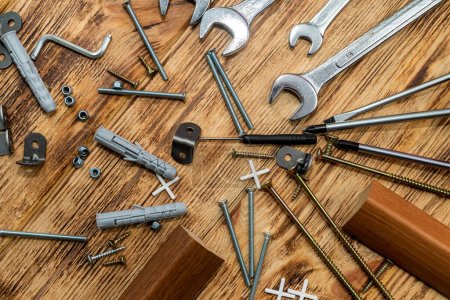 Photo for Lots of self-tapping screws and nails and construction screws and metal and plastic drywall anchors. Repair and tools for it - Royalty Free Image