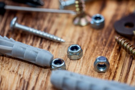Photo for Enlarged view of various screws from above. Mixed screws and nails. Industrial background. Home improvement. bolts and nuts. - Royalty Free Image