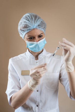 Photo for Caucasian woman nurse or scientist in full medical uniform preparing vaccine with syringe for human isolated. Vaccine from flu or coronavirus - Royalty Free Image