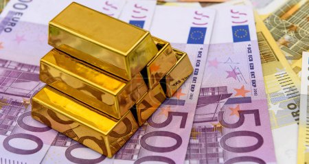 Gold bars on euro bills, investment saving concept. 100 200 500 Eu money. Wealth