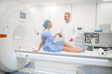 Photo for MRI procedure. Female patient having MRI procedure in the clinic - Royalty Free Image