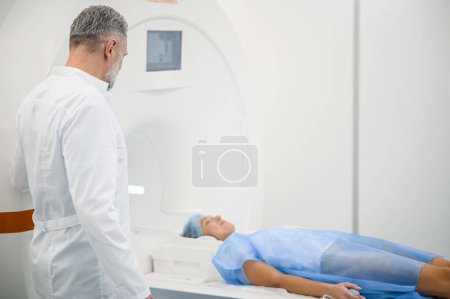 Photo for Diagnostic center. Doctor working in diagnostic center and looking involved - Royalty Free Image