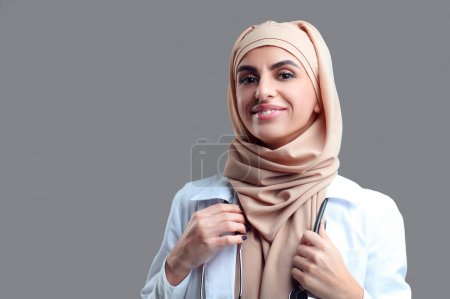 Photo for Happy woman. Young muslim woman in hijab looking contented and happy - Royalty Free Image