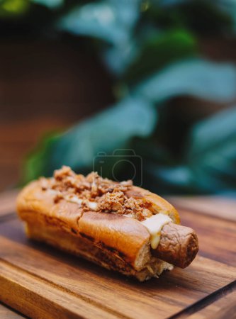 Photo for Delicious hot dog with sausages on a wooden board. - Royalty Free Image