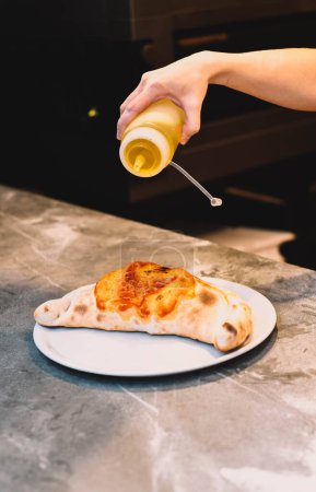 Traditional Italian calzone made with fresh dough in a wood-fired oven