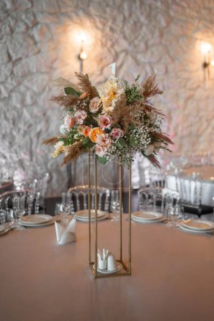 Photo for Boho wedding decor. Wedding centerpieces arrangements with dried flowers floristry and candles, boho style. Wedding day. - Royalty Free Image