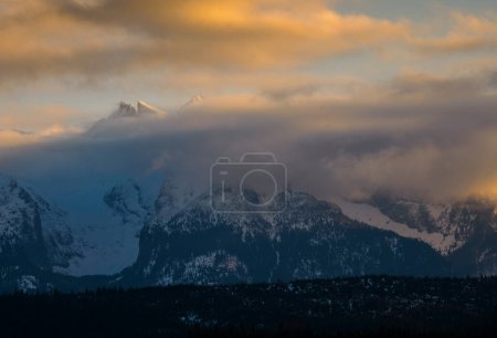 Photo for Mountain landscape.. Mountain peaks covered with clouds. View of the Tatra Mountains from the Spisz. Lapszanka. Poland. - Royalty Free Image